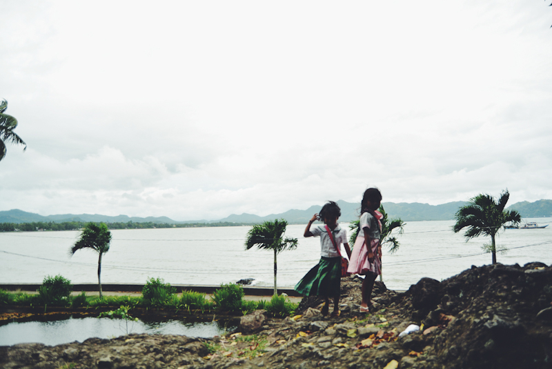 Young girls enjoy the view on top of the heart-shaped rock, where Rizal and Josephine Bracken used to hang out.